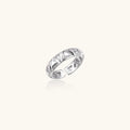 White gold adjustable ring with geometric triangle cutouts and zirconia stones on cream background